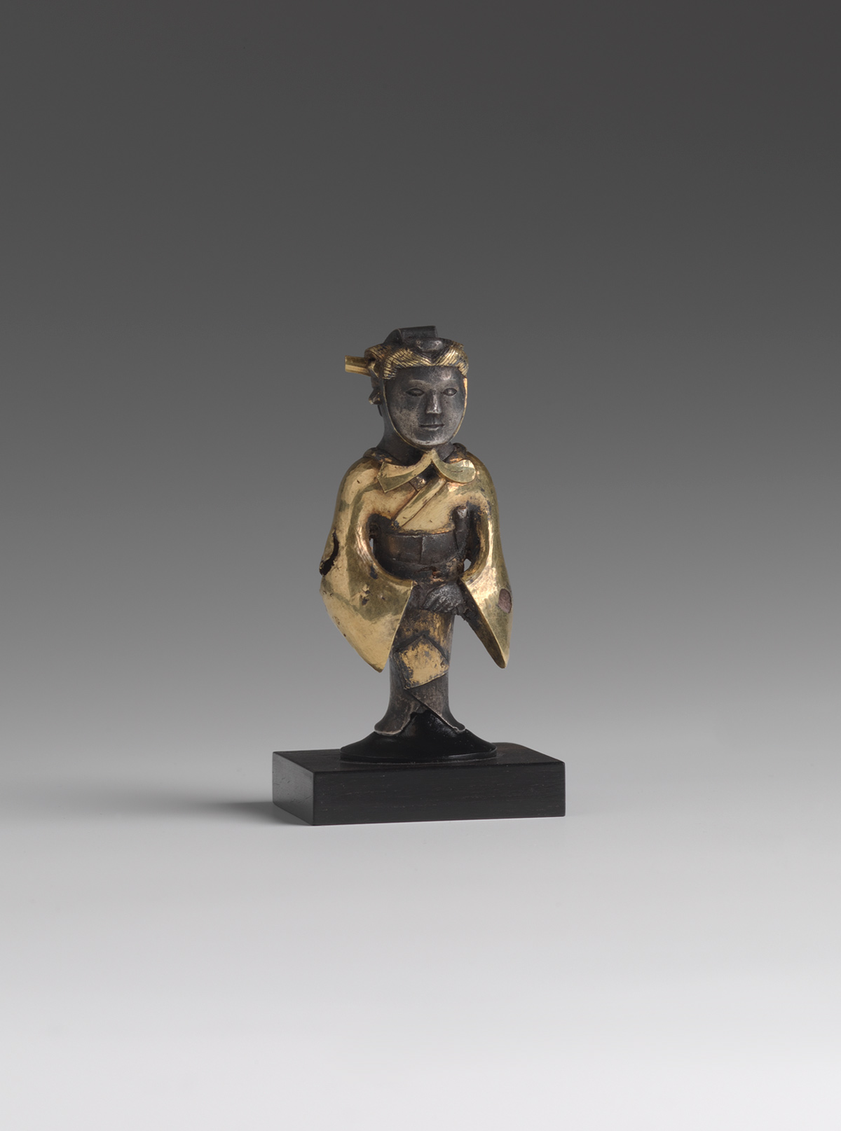 Gold and Silver Standing Figure