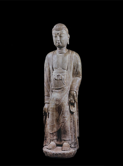 Limestone figure of a standing Buddha