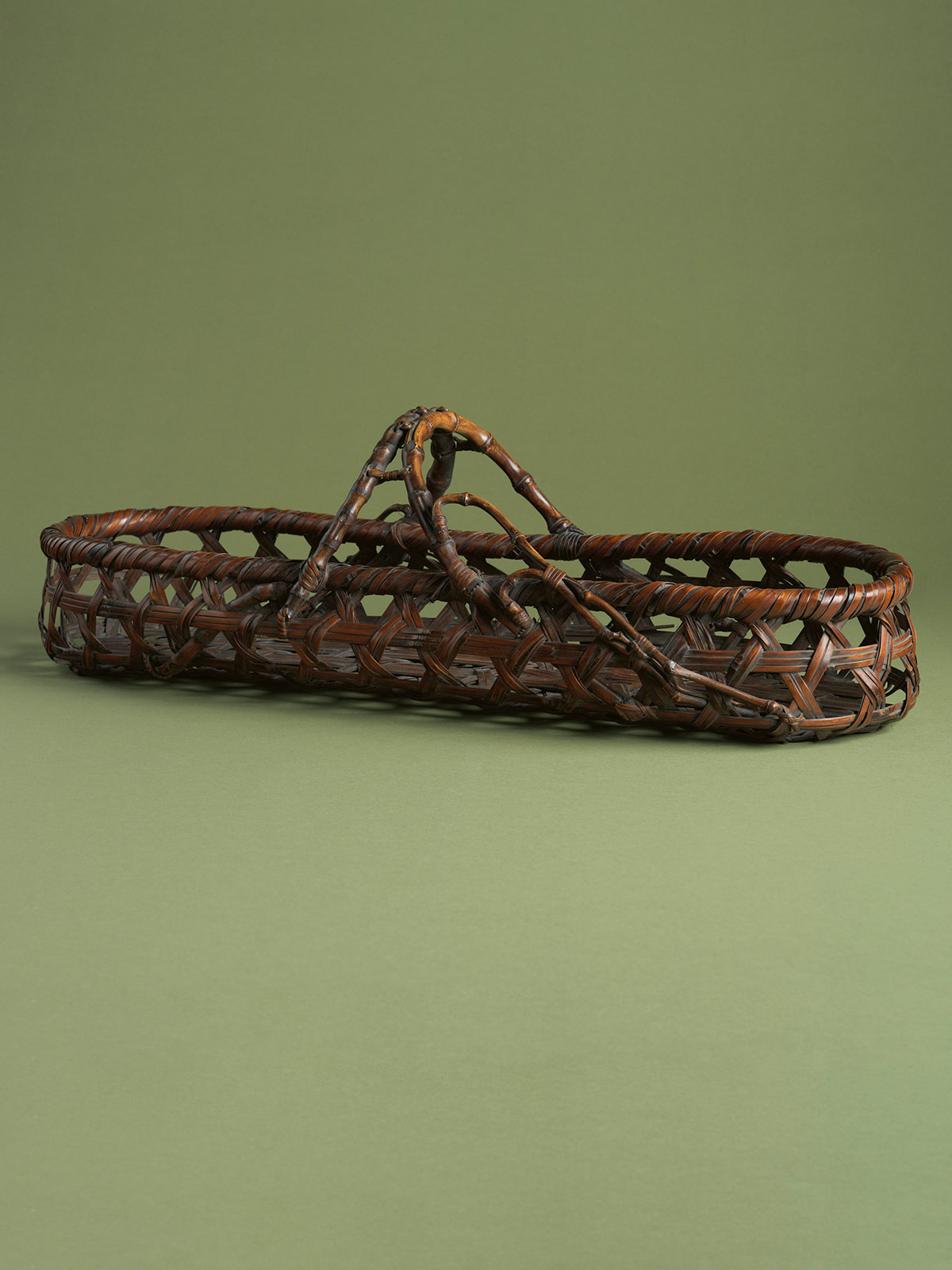 8. Flower basket in the form of a gabion with bamboo-root handle, 1928