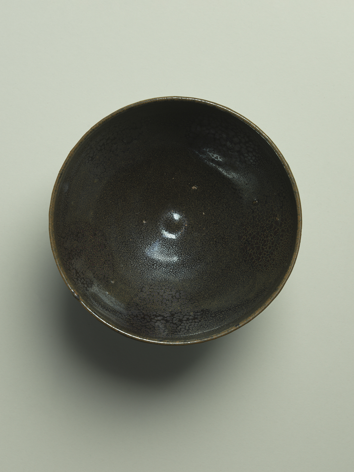 9. Black-glazed stoneware ‘oil-spot’ bowl