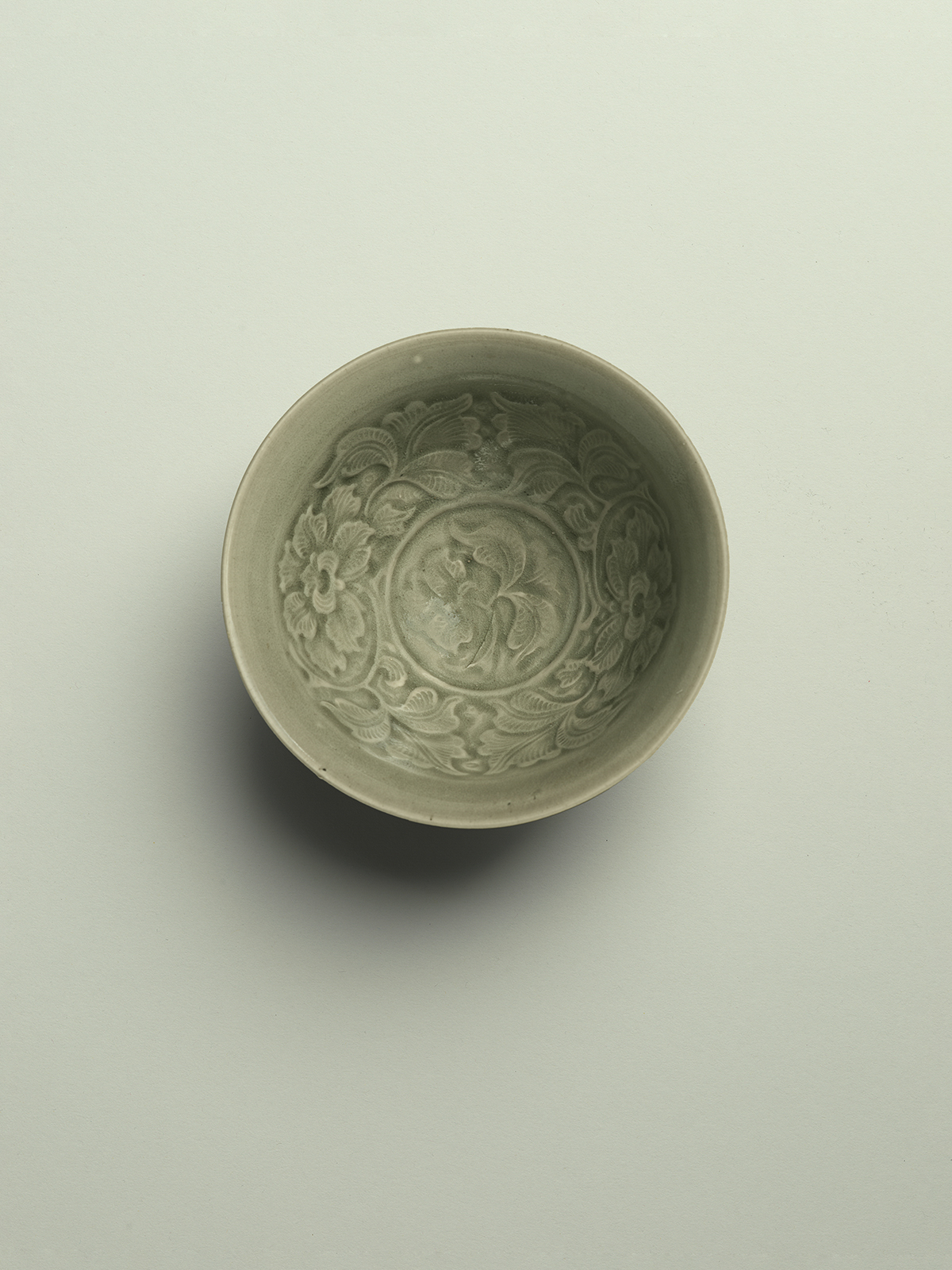 2. Green-glazed stoneware bowl