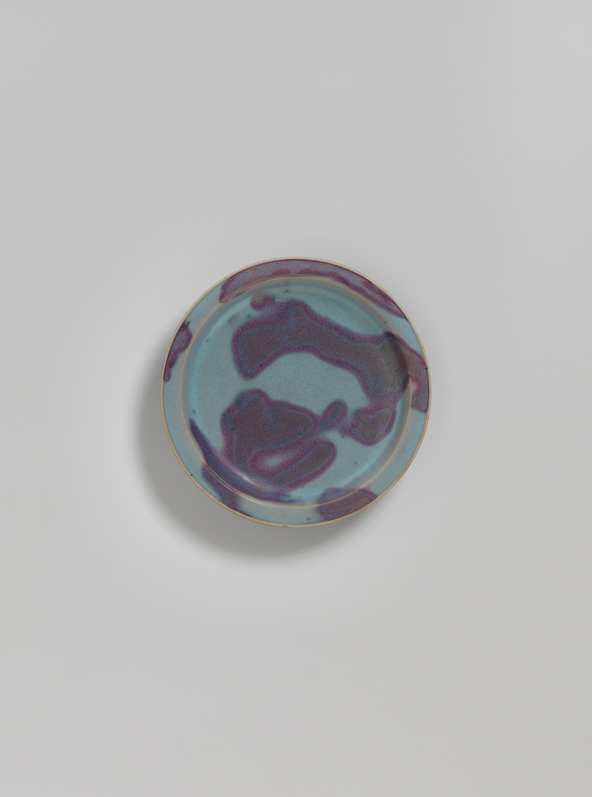 Blue-glazed splashed stoneware dish