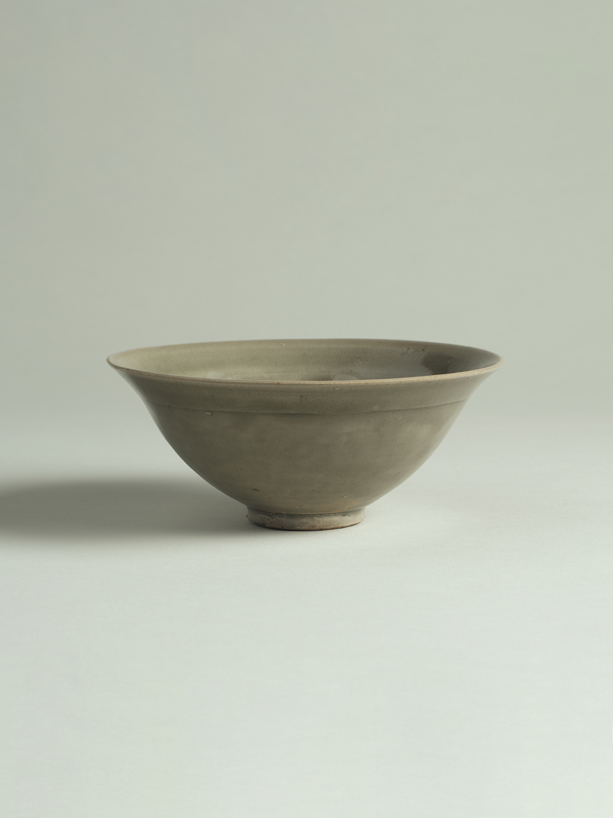 2. Green-glazed stoneware bowl