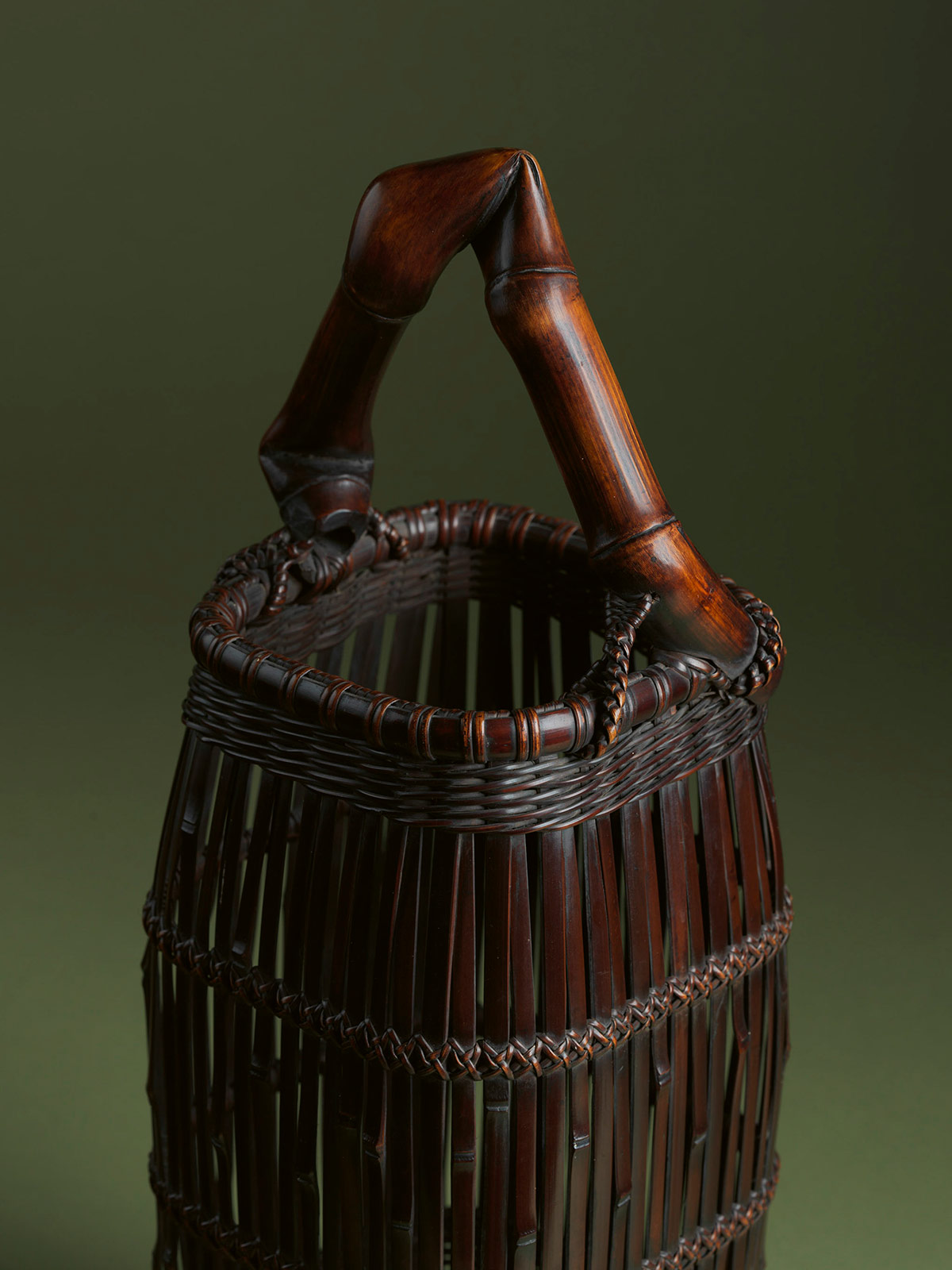 7. Smoked bamboo flower basket bound in the style of a suit of armour with bamboo-root handle