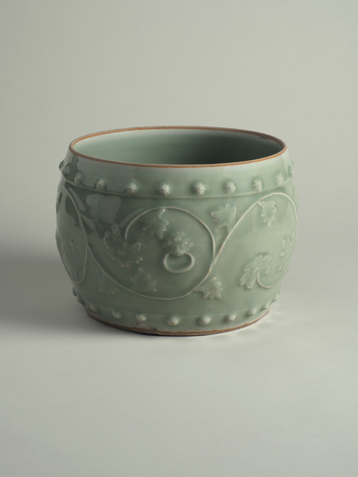 18. Celadon-glazed porcelain drum-shaped jar