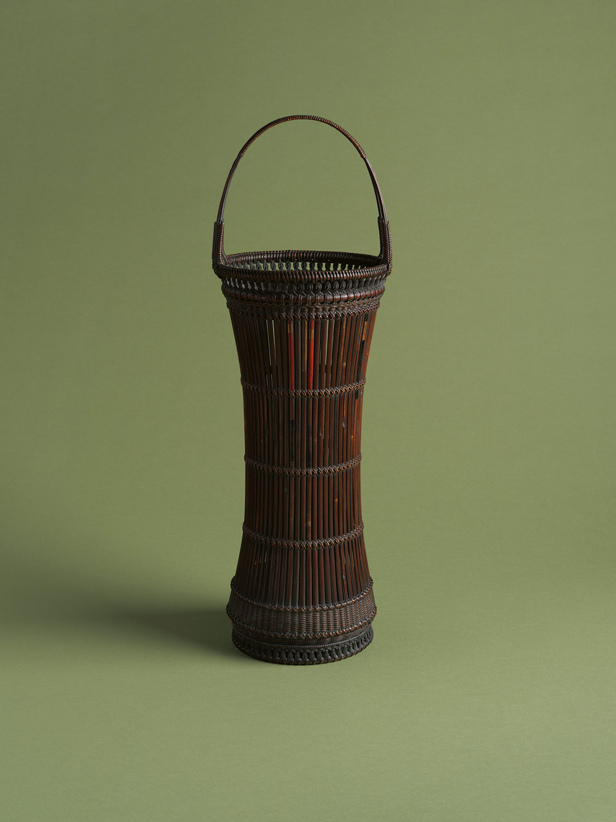 1. Drum-shaped flower basket made from old arrow shafts