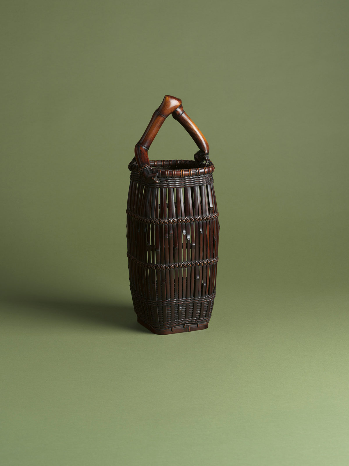 7. Smoked bamboo flower basket bound in the style of a suit of armour with bamboo-root handle